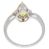 Elegant Green Peridot 14K White Gold Ring showcasing a pear-shaped gemstone with diamond accent from the side view.
